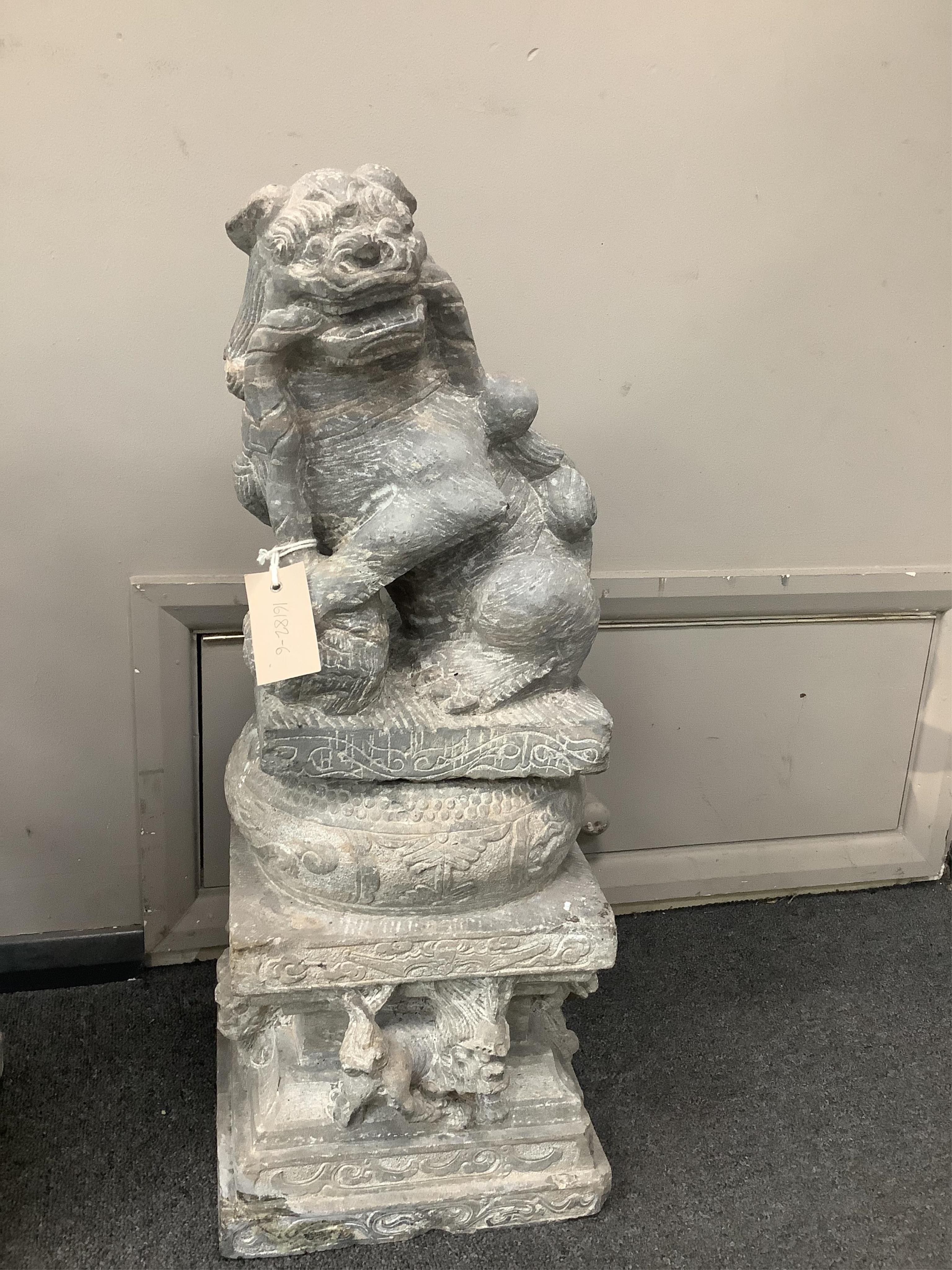 A pair of Chinese limestone supports for columns and a pair of Chinese limestone figures of Buddhistic lions Qing dynasty, 66cm high. Condition - fair